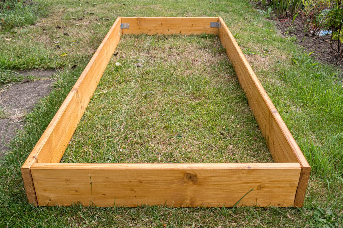 assembled raised garden bed container sitting on the grass