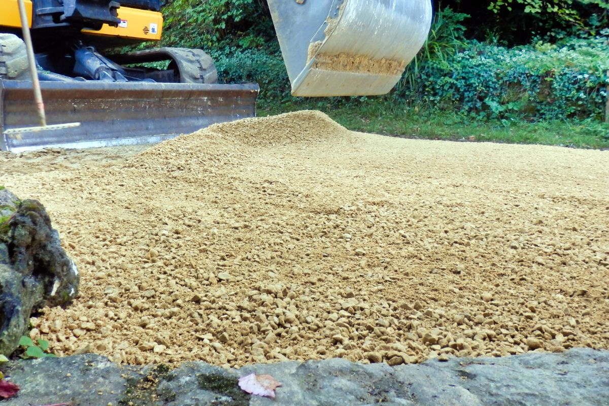 spreading new gravel on a driveway