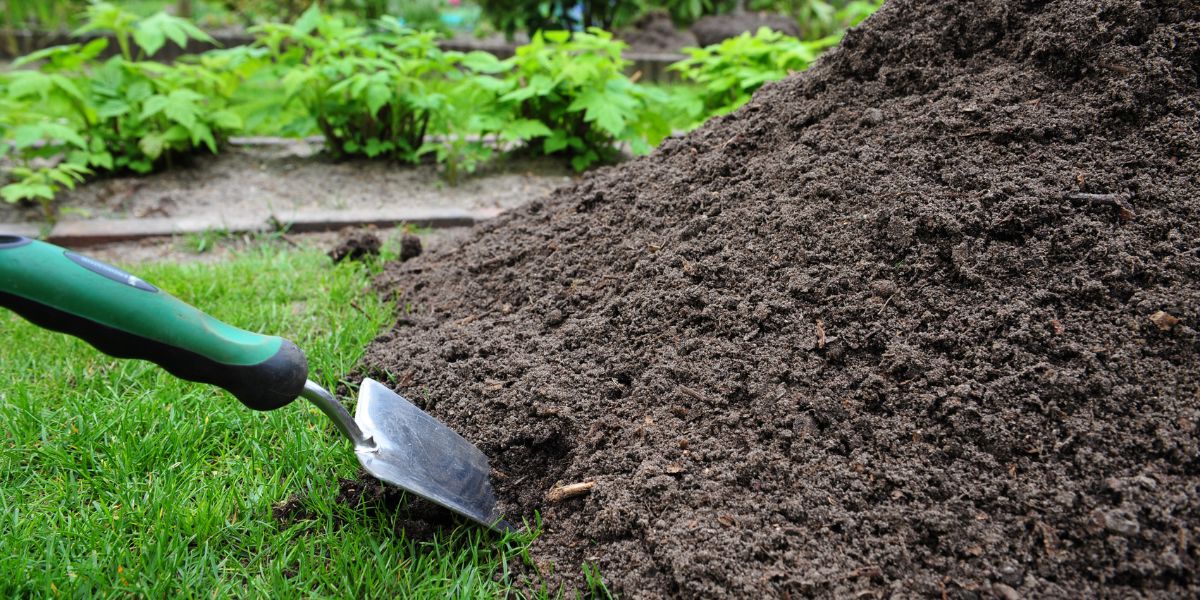 pile of compost on lawn